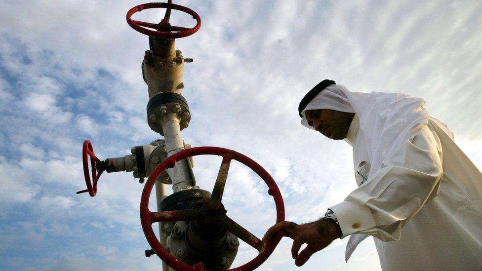 File photo showing a man looking at a natural gas pipe in Manama, Bahrain (3 November 2002)