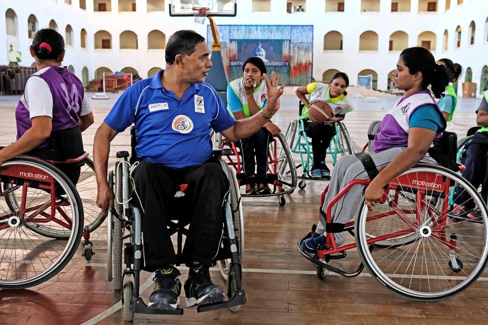 Coach Anthony Pereira talking to one of the players