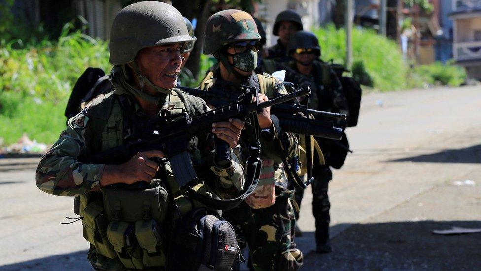 Reinforcement government soldiers march at Amai Pakpak, as government troops continue their assault against insurgents from Maute group, who has taken over large parts of the Marawi City, Philippines 13 June 2017.