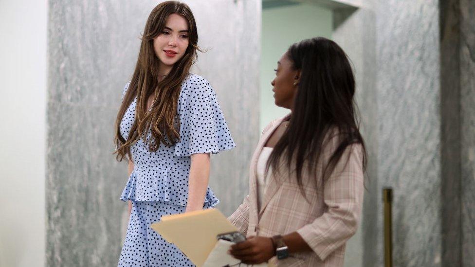 McKayla Maroney, left, and Simone Biles leave following their testimony before the Senate in September