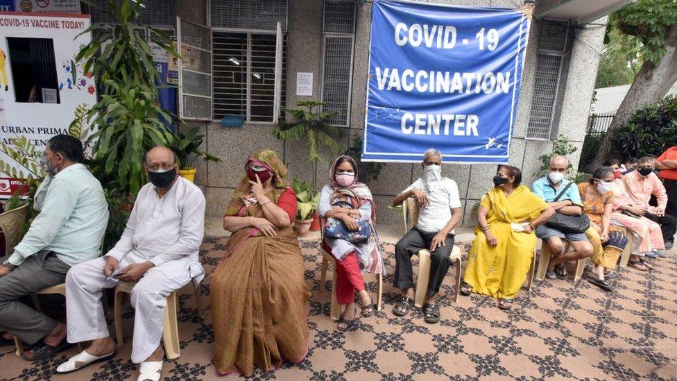 People waiting in line for vaccination in India