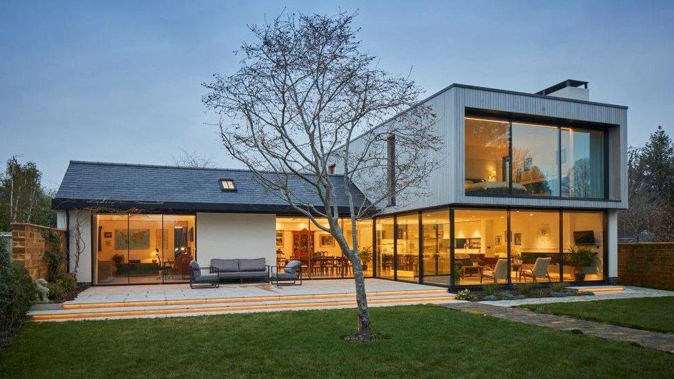 Contemporary two-story house with large windows