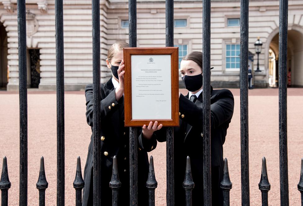 A sign announcing the death of the Britain's Prince Philip, Duke of Edinburgh is placed on the gates of Buckingham Palace