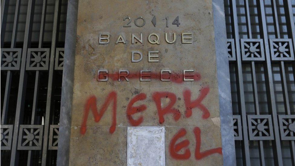 Bank of Greece plaque with Merkel graffiti