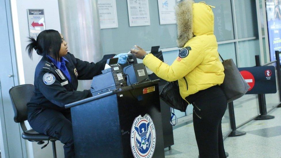 People being checked at TSA screening