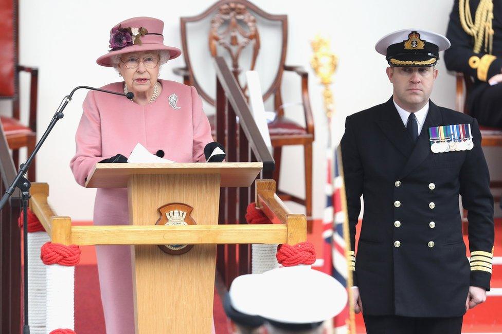 The Queen and Captain Robert Pedre, the commanding officer of HMS Ocean