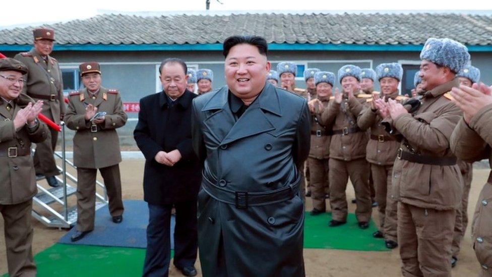 A state media image said to show Kim Jong-un inspecting the testing of a "super-large multiple-rocket launcher"