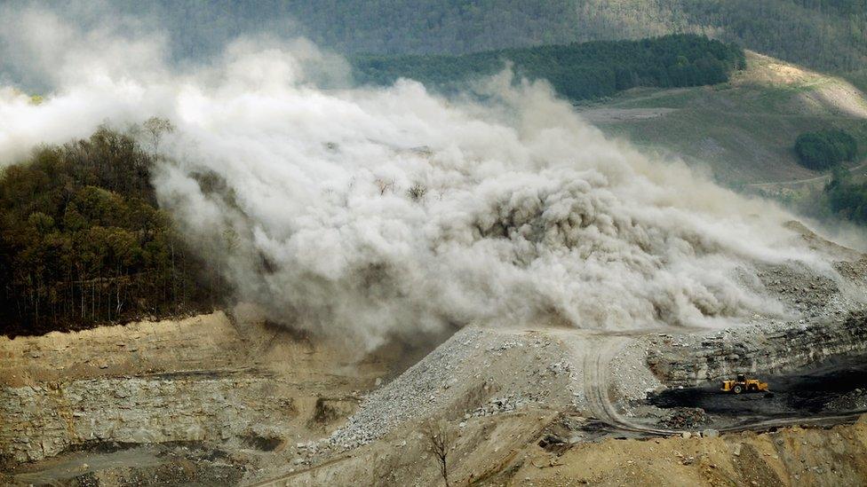 Image shows an explosive being detonated at a surface mining operation in the Appalachian Mountains