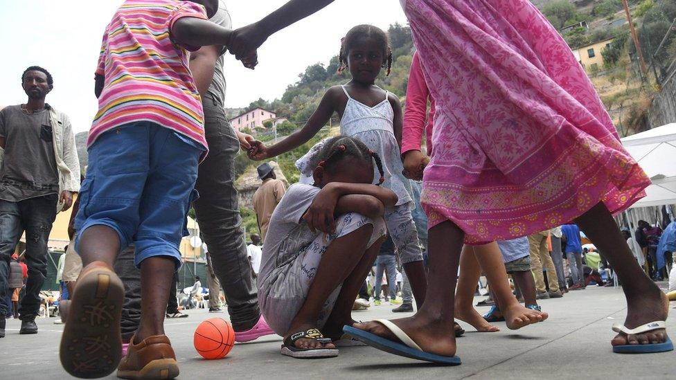 Migrant children play on a sports field on the premises of the Sant'Antonio Parish in Ventimiglia, Italy, 08 July 2016