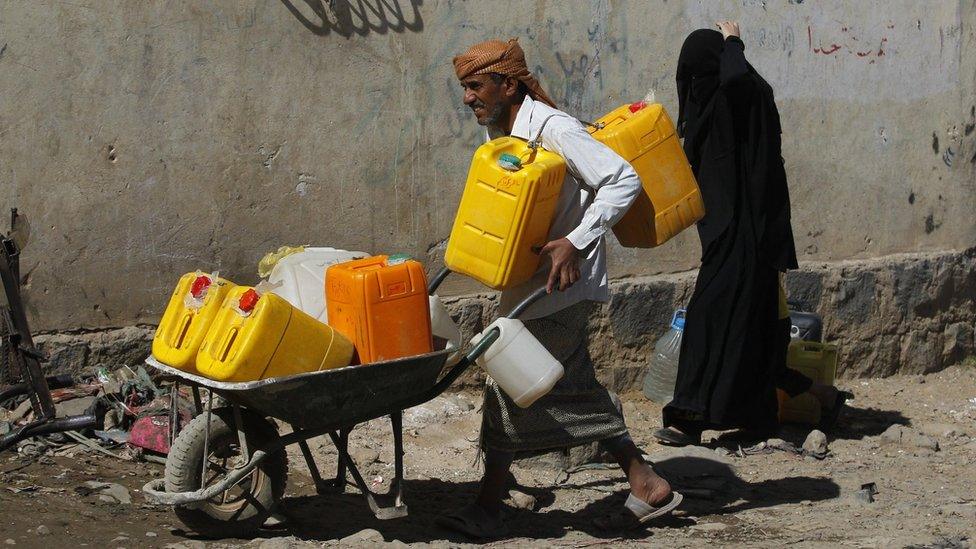 Yemenis wait to collect drinking water from a donated water pipe in Sanaa, Yemen, 18 November 2017