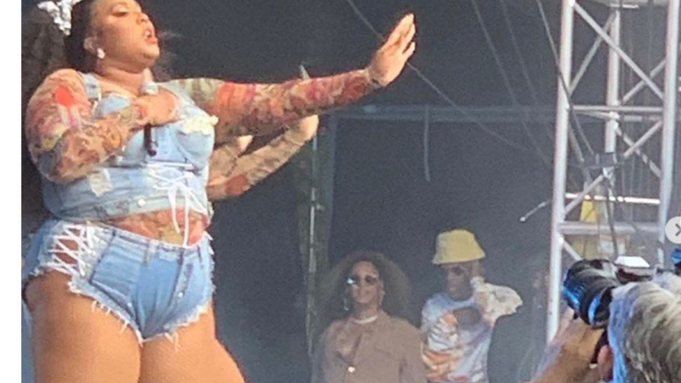 Lizzo performing at day 2 of the Made in America Festival with Beyonce and Jay Z at the side of the stage