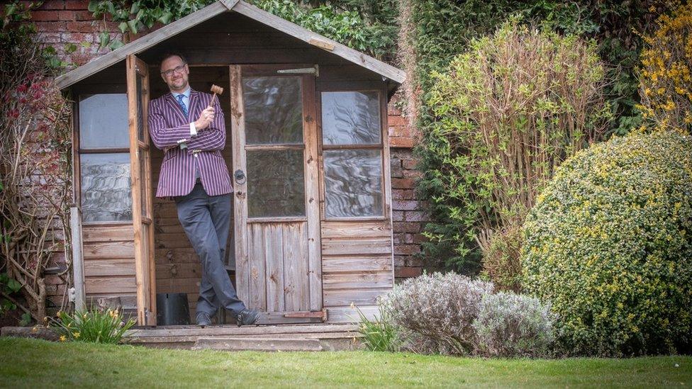 Charles Hanson in a garden shed