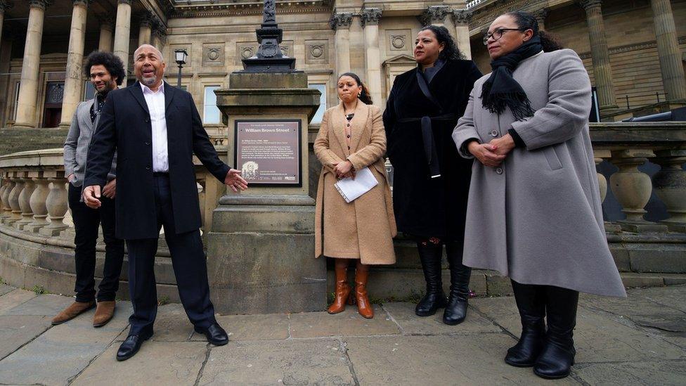 Andrew Lynch (2nd left) the son of Eric Lynch during the unveiling of the bronze plaque