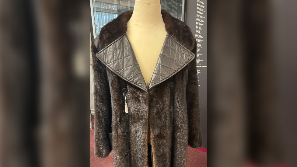 A photo of the mink leather coat on a mannequin