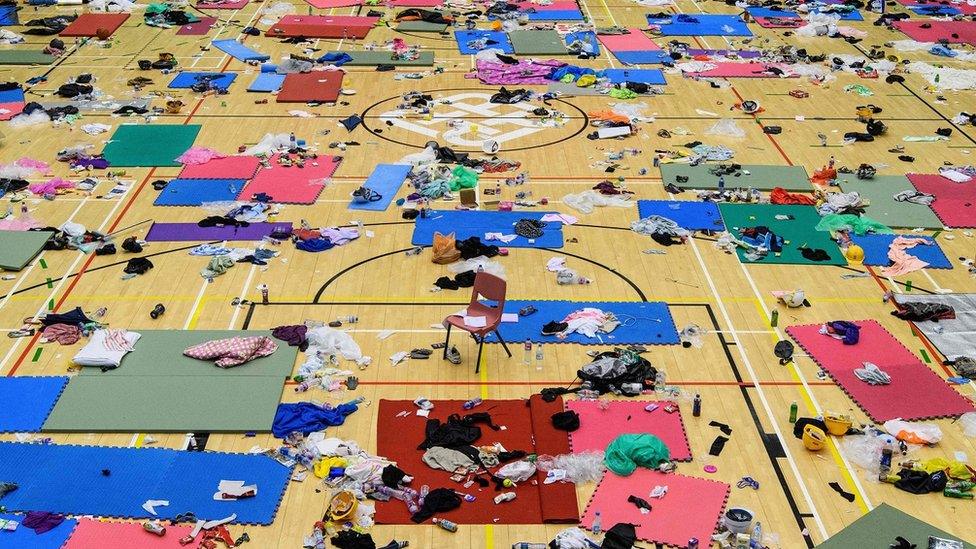 Belongings are left on a basketball court