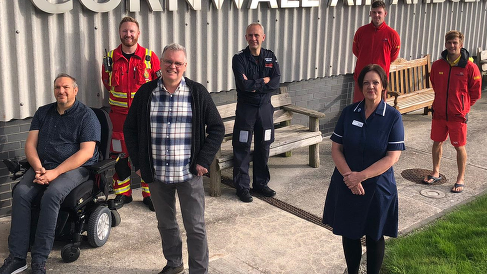 Mr Barendt (centre left) and the team of people who saved his life