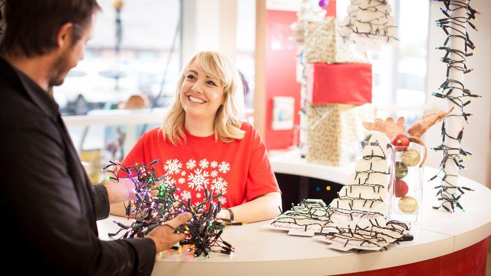 Anya Mugridge working as a Christmas lights untangler