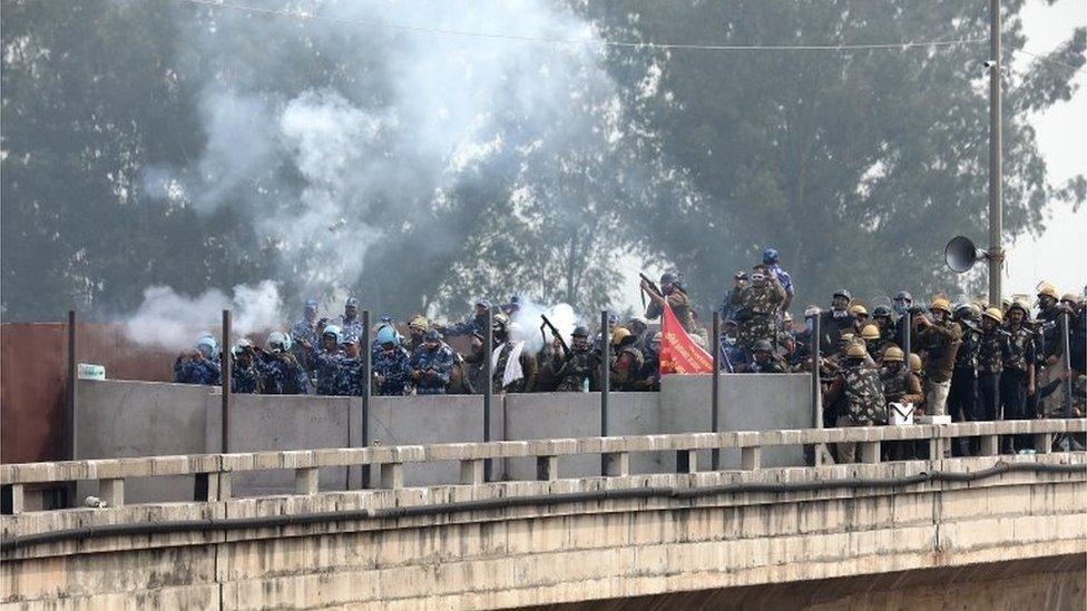 Indian police throw teargas on the protesting Punjab farmers to prevent them moving towards Delhi at Shambhu Haryana Punjab border, 250 kilometers from Delhi, India, 13 February 2024.