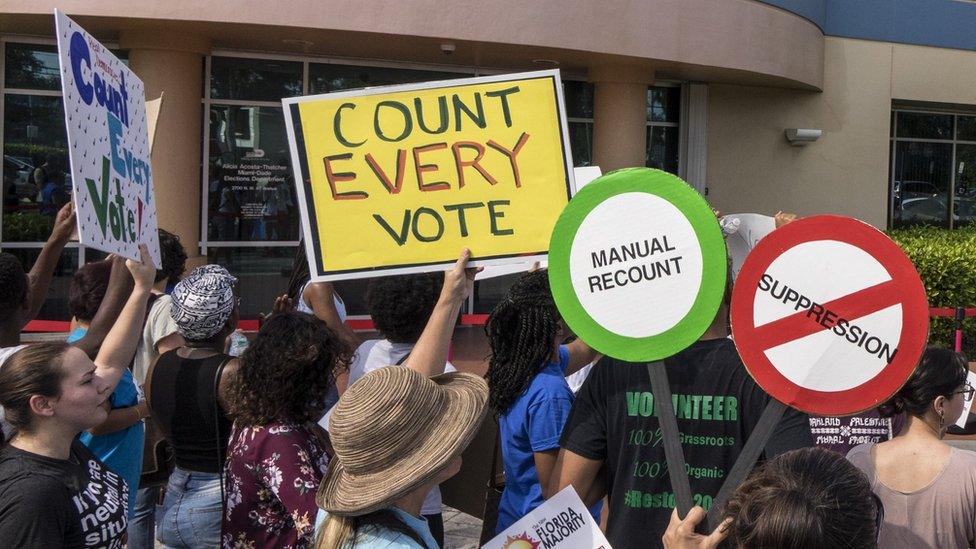 A crowd protests to demand a vote recount in Miami, Florida