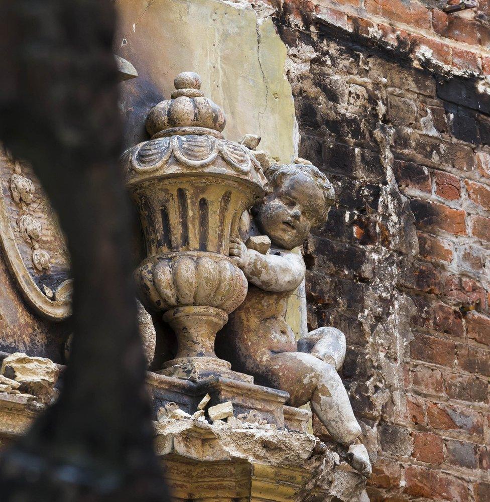 Part of the fireplace in the saloon