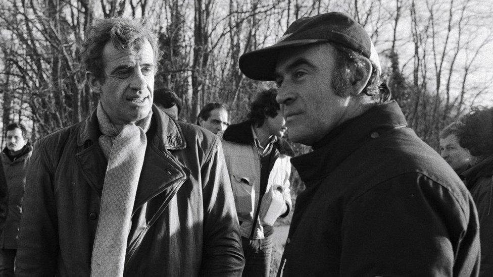 Jean-Paul Belmondo in Venice, Italy on October 22, 1979 - Jean-Paul Belmondo with Remy Julienne