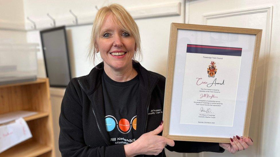 Jill Neighbour holding her civic award