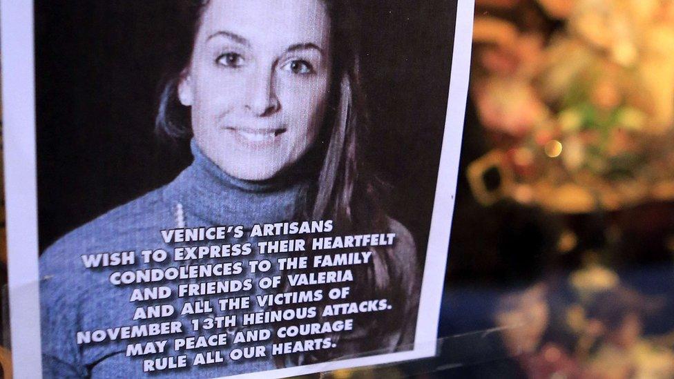 A portrait of Valeria Solesin is displayed in a souvenir shop in Venice