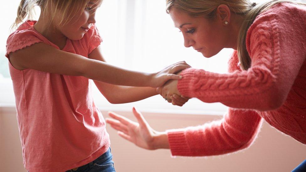 woman smacking girl