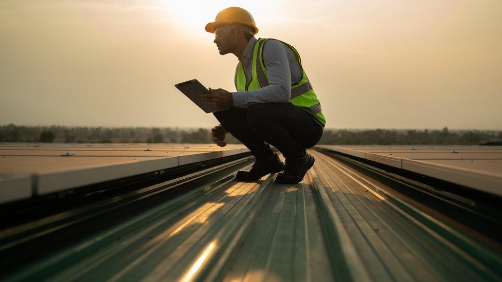 Engineer checking solar panels