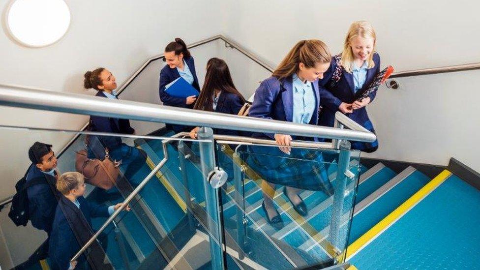 Secondary pupils on stairs