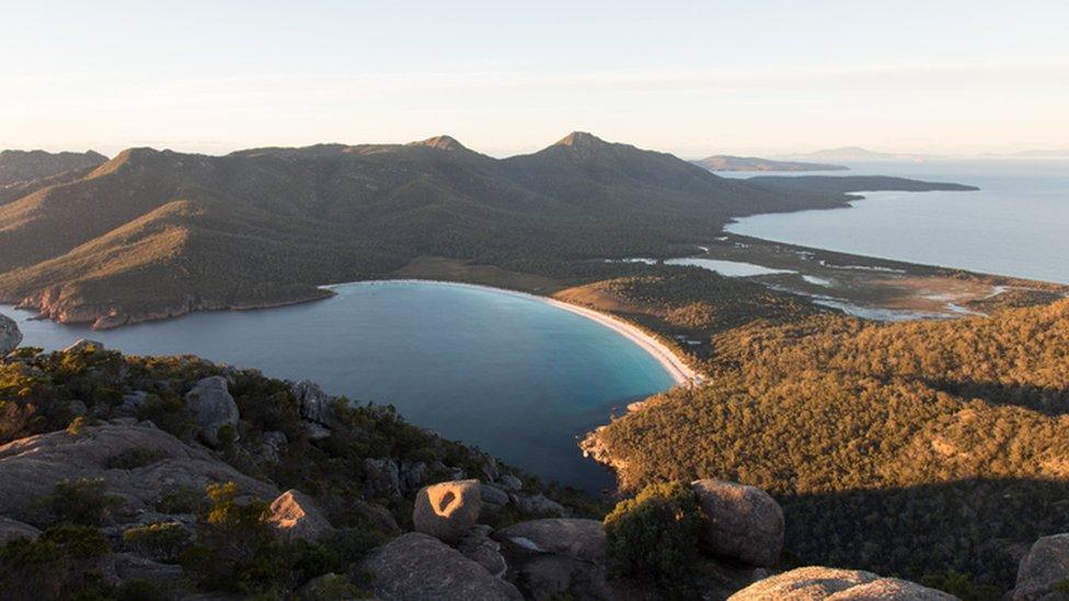 Tasmania coastline, white beach and windswept peaks