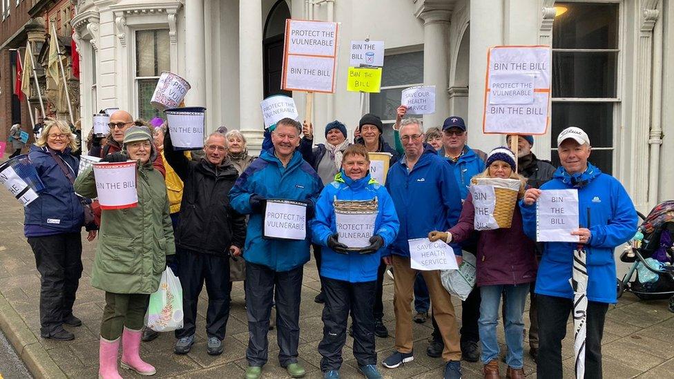 Protestors against proposed assisted dying legislation outside the Isle of Man legislative buildings