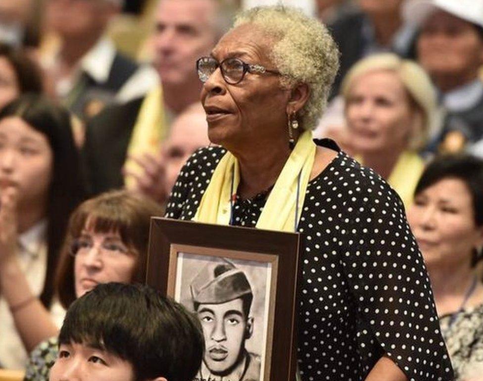 Gail Embery with a picture of her father