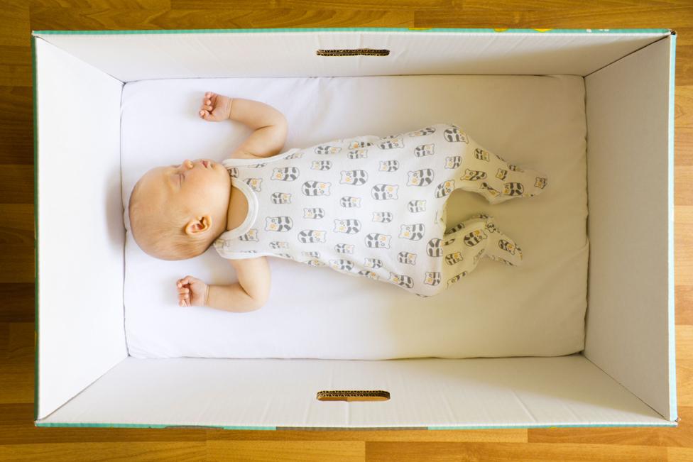 Baby asleep in baby box