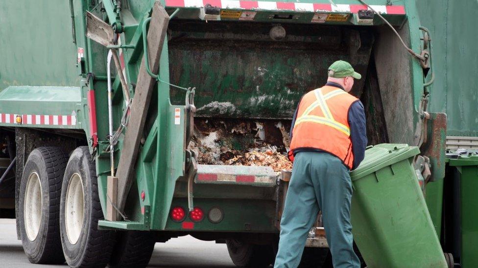 Bin man emptying a bin into a lorry