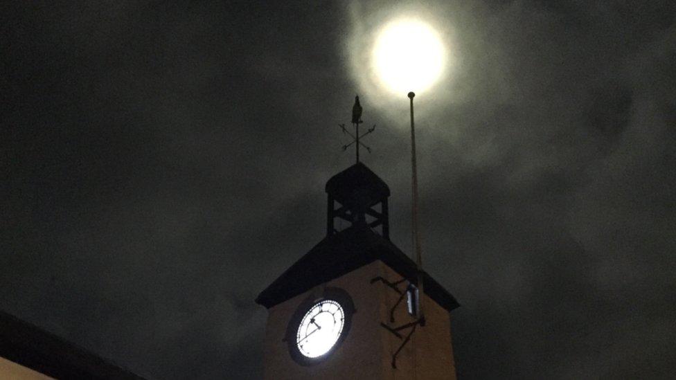 The supermoon lighting up Laugharne's town hall