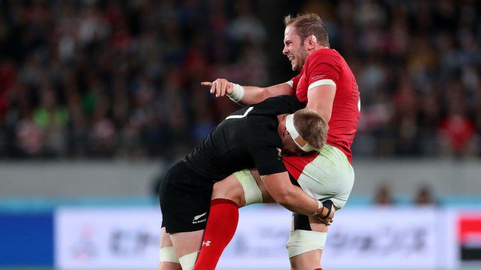 Alun Wyn Jones tackled by Sam Cane