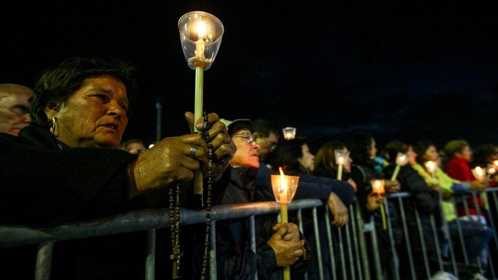 Devotees holding candles participate at the traditional candles procession at Fatima"s Sanctuary, Portugal, 12 May 2017