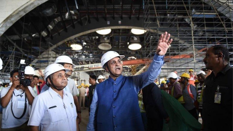 Gujarat's Chief Minister Vijaybhai Rupani (C) gestures next to Gujarat"s Deputy Chief Minister Nitinbhai Patel (L) during their visit to the Statue Of Unity on 25 August 2018