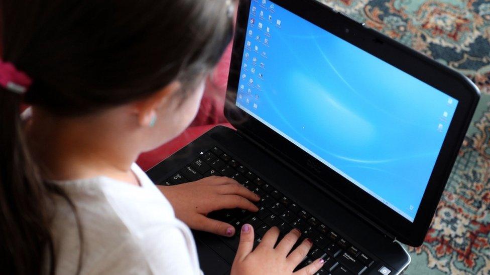 Child watching laptop