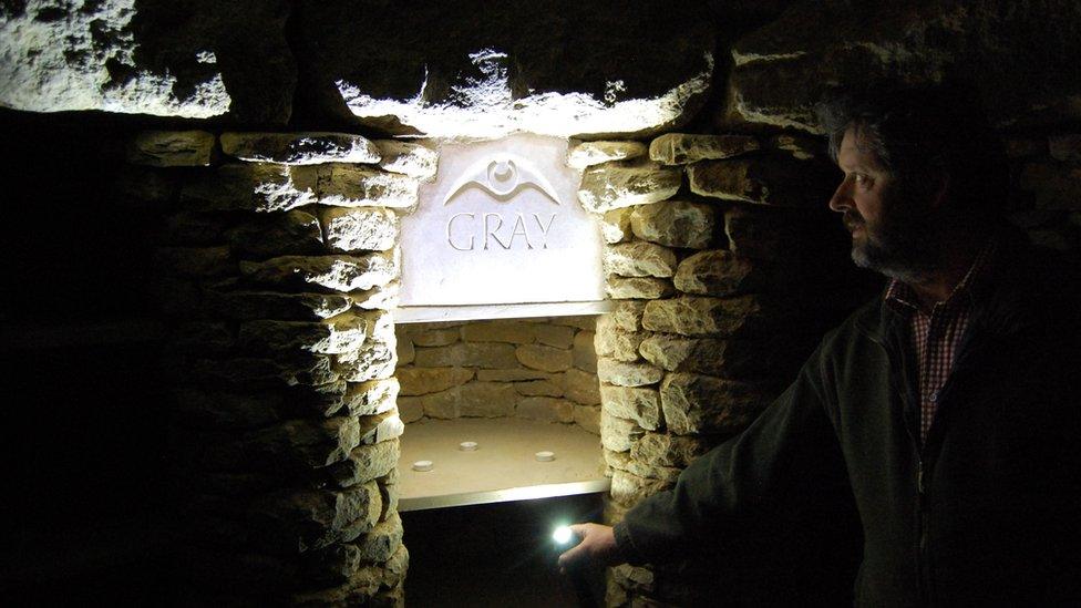 Tim Daw inside the All Cannings long barrow