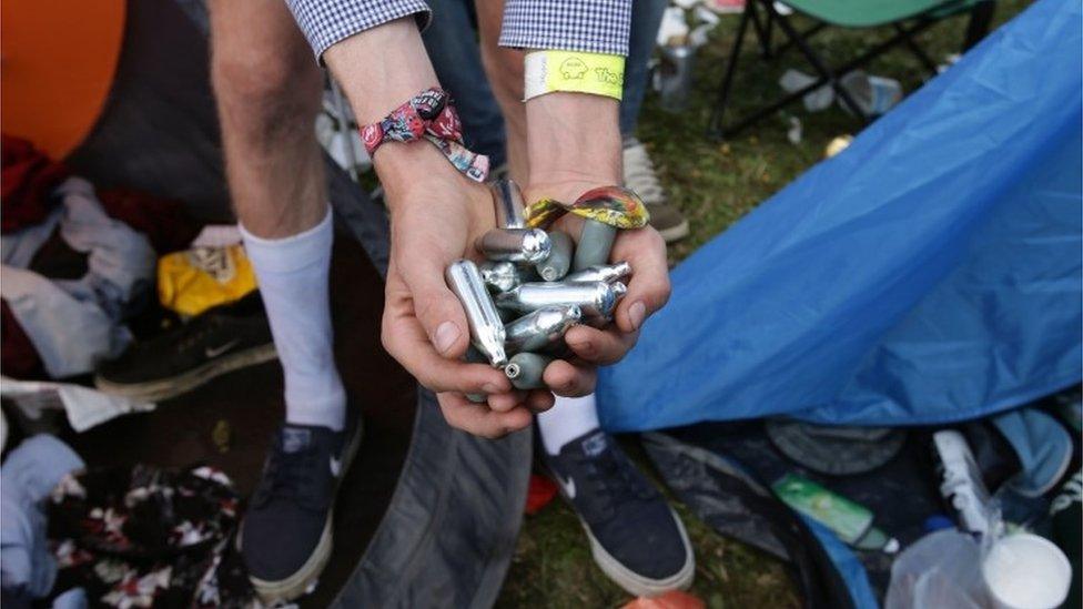 Discarded nitrous oxide canisters at a festival