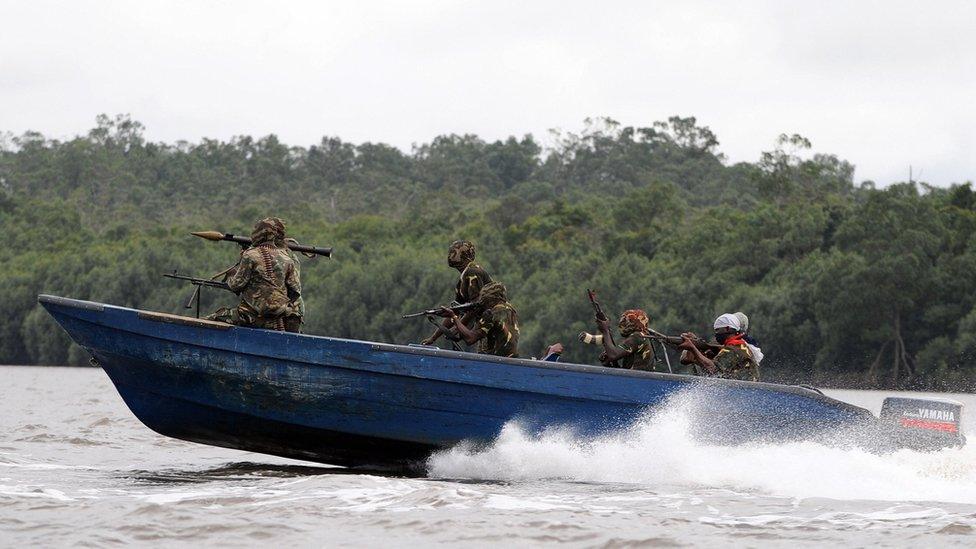 Fighters with the Movement for the Emancipation of the Niger Delta (MEND) head off for an operation against the Nigerian army in Niger Delta on September 17, 2008.