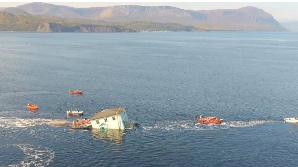 house-moving-across-water.