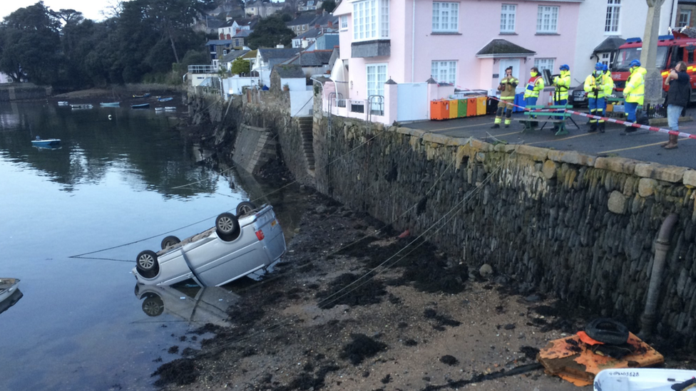 Overturned van in quay