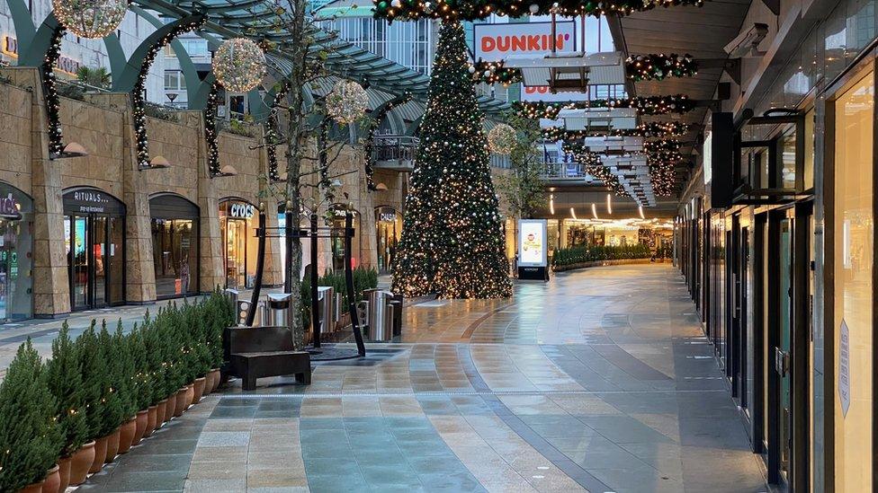 Image shows a shopping street in the Netherlands