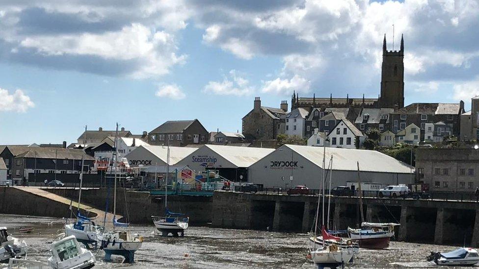 View of Penzance harbour with dry dock at low tide