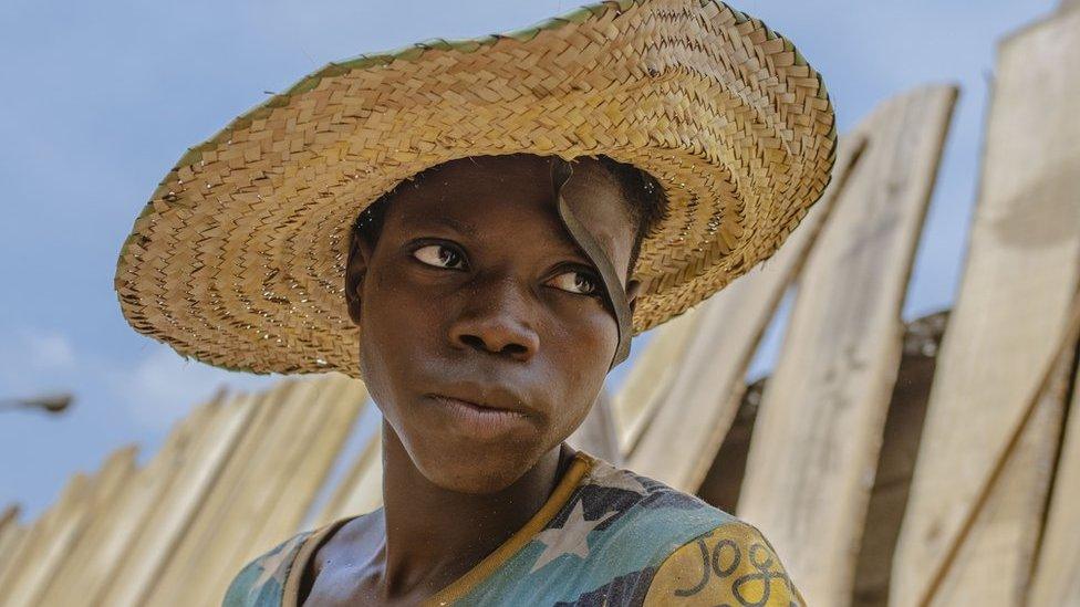 Man with straw hat on his head