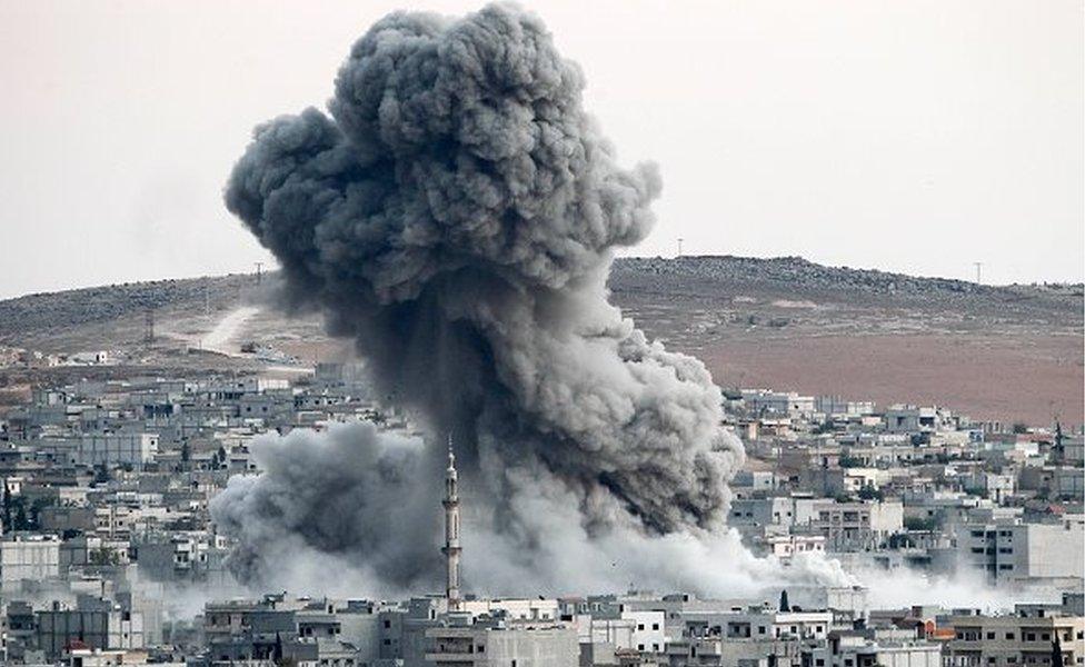 Heavy smoke rises following an airstrike by the US-led coalition aircraft in Kobani, Syria, during fighting between Syrian Kurds and the militants of Islamic State group