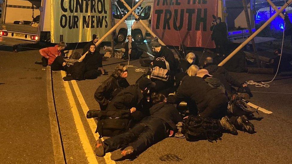 Protesters at a blockade near a printing press